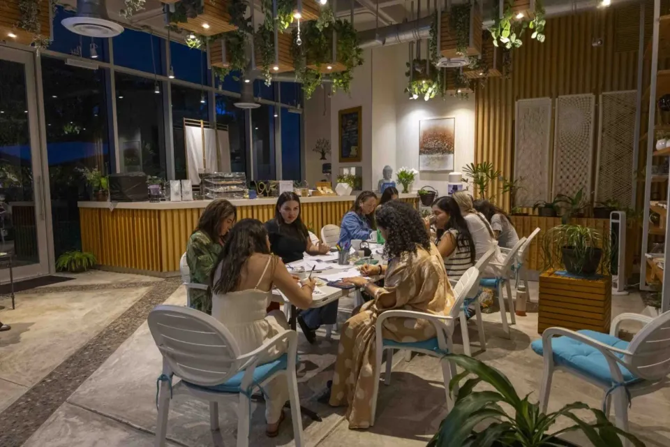 a group of people sitting at a table